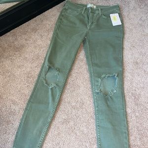 Free People skinny jeans size 27, holes in both knees. NWT $50